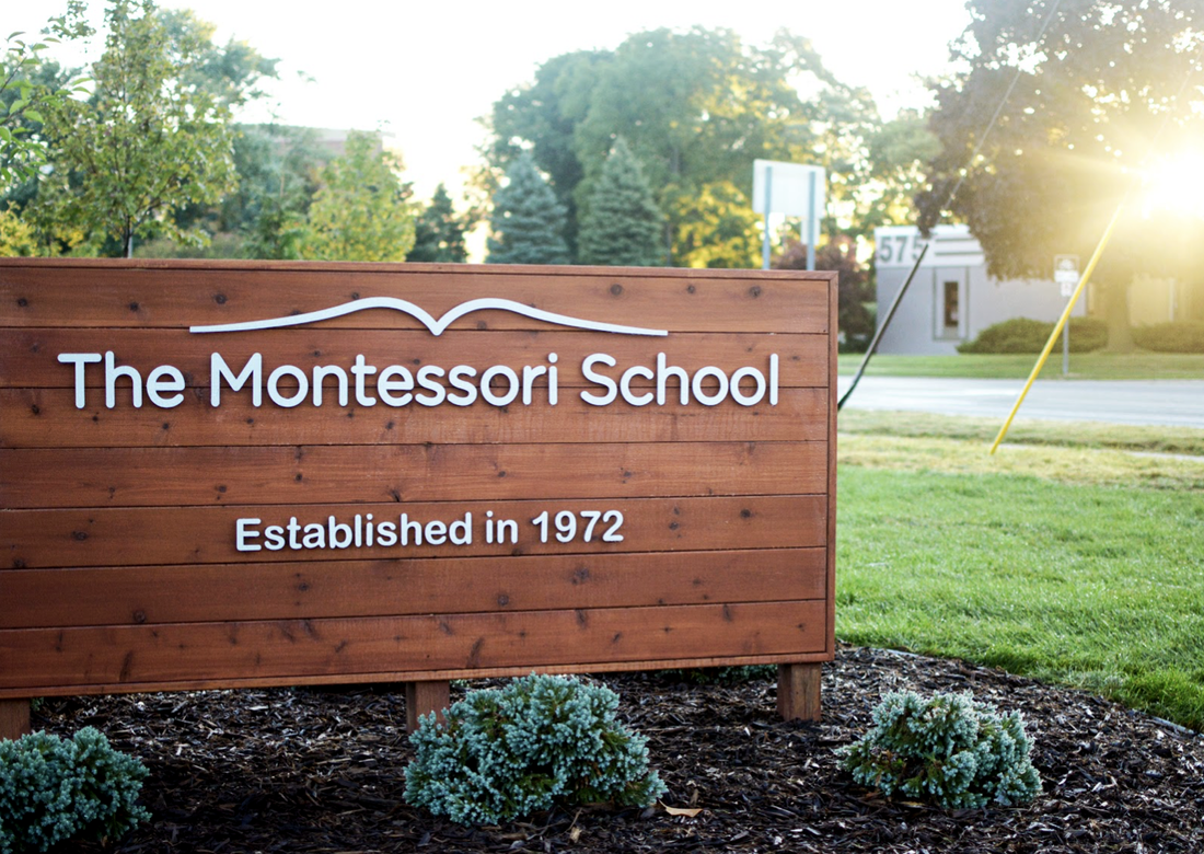 Sun rising over Montessori School sign